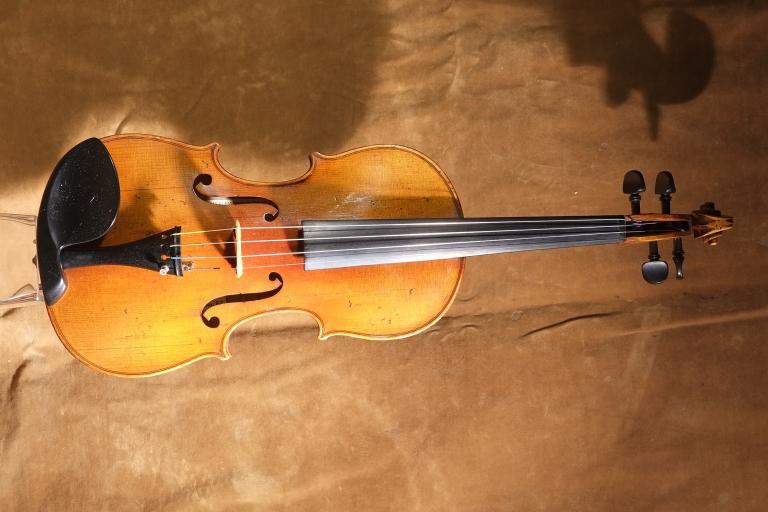 A violin. Partially obscured.