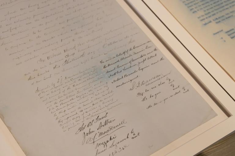 A document that forms part Treaty #3, displaying the signatures of Crown negotiators and First Nations Chiefs. Partially obscured.