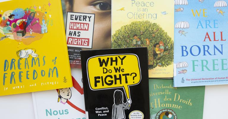 The covers of seven books in English and in French. Partially obscured.