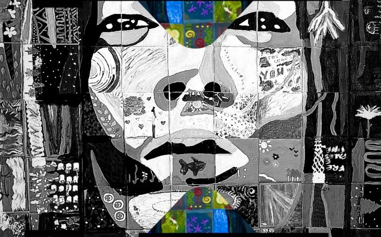A painting, mostly in black and white with a few splashes of colour, is in the style of a mosaic so that different tiles contain various natural elements—a fish, flowers, mountains, fields. Together the tiles become a human face directly looking at the viewer with an intense expression. Partially obscured.