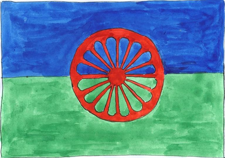 A painting of the Romani flag, which is blue on top, green on the bottom and has a red chakra that looks like a wagon wheel in the centre. Partially obscured.