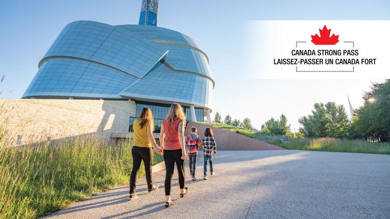 A group of people walk towards a glass building surrounded by greenery. At the top of the image, we can read "Canada Strong Pass" in English and French. Partially obscured.