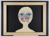 A cut-out shape of a girl’s head is wrapped in masking tape that covers her mouth and nose, with only large, sad-looking eyes revealed. Inside each pupil is the ASL sign for love.